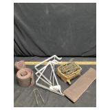 Miscellaneous hooks, sandpaper, and bracket