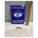 Metal evil eye sign