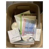 Tote of office supplies