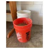 Buckets and  grass seed