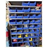 Plastic parts bins on metal shelving unit with