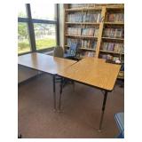 To adjustable tables and gray chair contents not