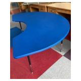 Adjustable plastic horseshoe table in lunchroom