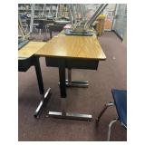 23 adjustable desks, contents, not included