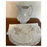 Needlework and pitcher