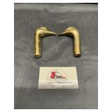Brass bird heads