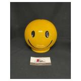 Smiley Face Coin Bank marked USA on bottom.