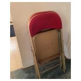 Two red folding chairs