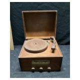 Vintage traveler tabletop radio and photograph