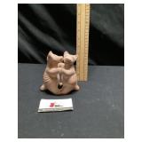 Terra-cotta dancing dogs