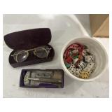 Dice, eyeglasses, razor
