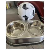 Pet bowls and soccer ball
