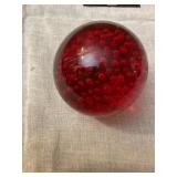 Red glass paper weight