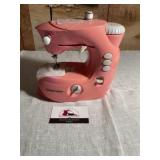 Pink dress maker sewing machine toy