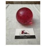Red glass paperweight