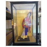 Oriental doll in show case