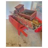 Red wooden wheelbarrow & decor