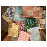 Baby quilts and tie blankets all appear new