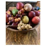 Fake fruit in wooden dough bowl