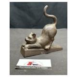 Cast cat door stop