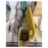Metal basket full of garden tools