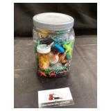 Jar of small dinosaurs and animals