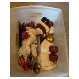 Tote of Christmas ornaments and decor
