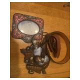 Western frames, bolo, tie, and belt
