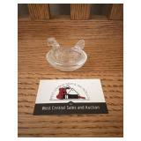 Mini glass hen on a nest