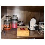 Speakers, candles and shelf contents