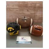 Assorted football  banks, one featuring Iowa