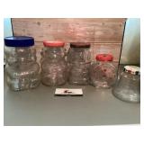 Glass jar advertising with coin banks