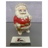Vintage ceramic Santa Claus coin bank features