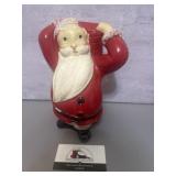 Vintage Santa bank featuring the coin slot in t