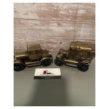 2- vintage metal coin banks featuring