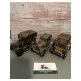 3-  metal coin bank featuring