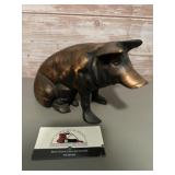 Vintage cast iron piggy bank, often featuring a