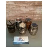 Assorted barrel coin banks featuring banks in t