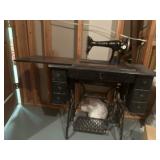 Singer sewing machine in cabinet