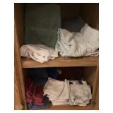 Cupboard, contents towels, and washcloths bring
