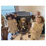 Totes of porcelain dolls