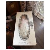 Porcelain doll appears to be on open