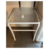 Small glass top outdoor table approximately 30" x