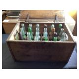 Wooden crate with glass bottles