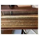 Assorted yardsticks with advertising