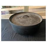Cast-iron three legged Dutch oven or camp oven