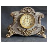 Antique cast iron, brass footed mantle clock