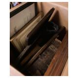 Box of vintage books and framed photos