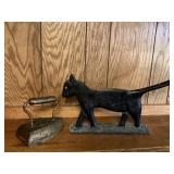 Sad irony and cast iron cat/panther