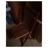 Wooden chair and small round black table with legs